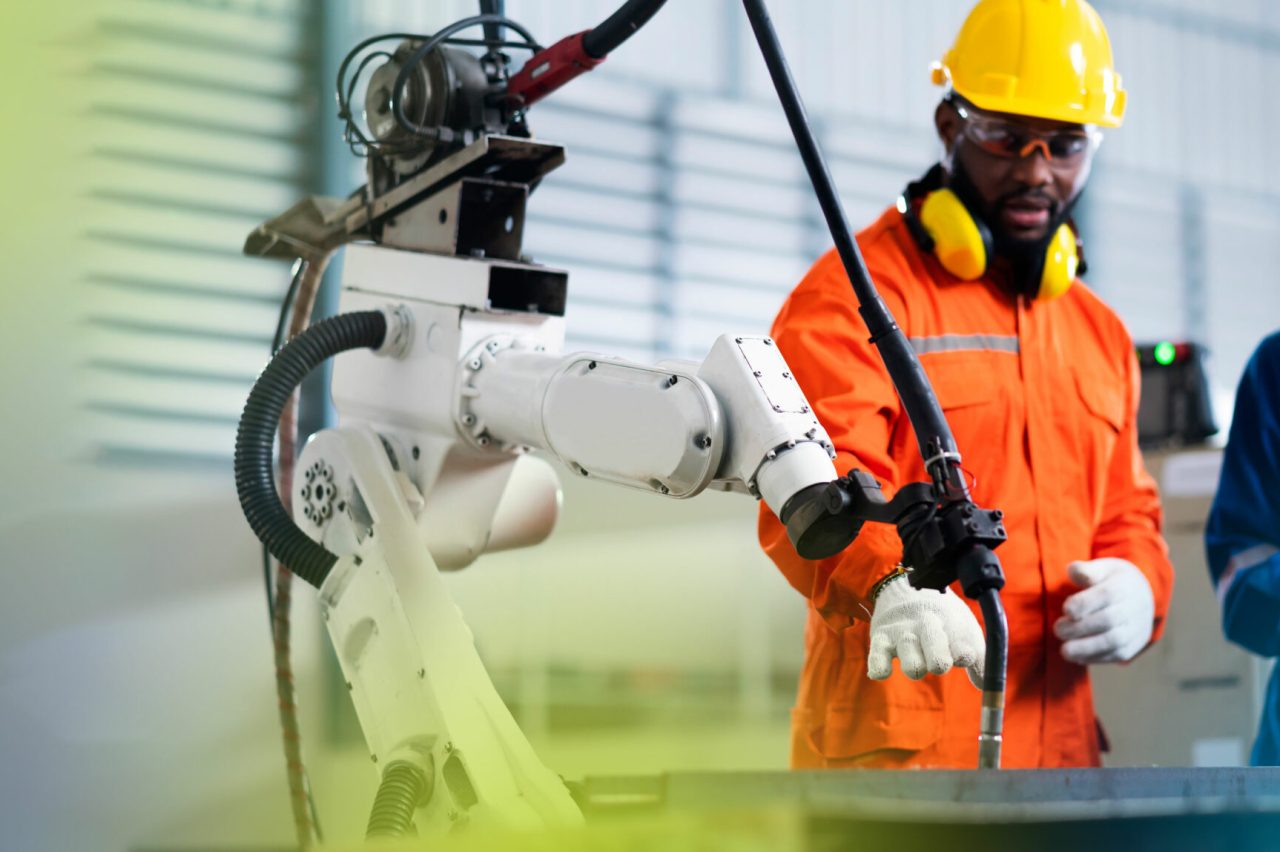 engineer-cooperation-male-female-technician-maintenance-control-relay-robot-arm-system-welding-with-tablet-laptop-control-quality-operate-process-work-heavy-industry-40-manufacturing-factory